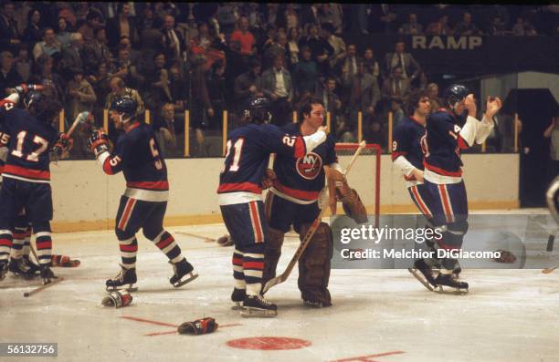 Members of the New York Islanders including Denis Potvin , goalie Billy Smith, Clark Gillies and Bob Bourne celebrate their overtime victory against...