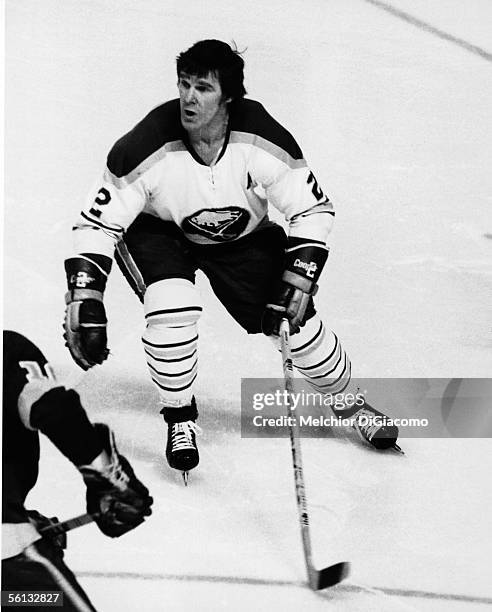 Canadian professional hockey player Tim Horton of the Buffalo Sabres skates during a game, mid 1970s.