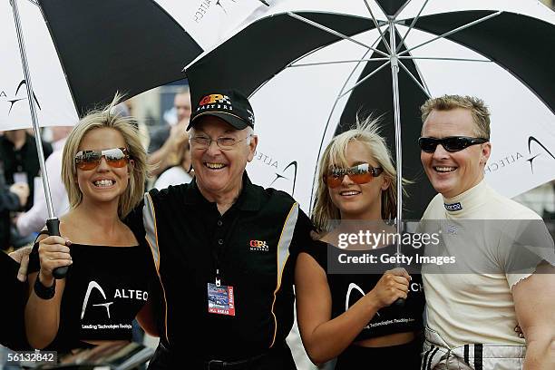 Murray Walker poses for a picture with F1 x 2 driver Johnny Herbert during a street demonstration prior to the inaugural Grand Prix Masters race at...