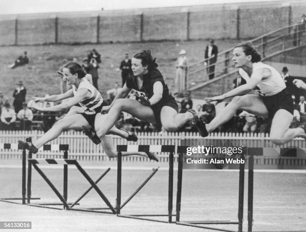 The first heat of the 80 metres hurdles at the British Empire Games in Sydney, 24th February 1938. From left to right, England's Ethel Raby, South...