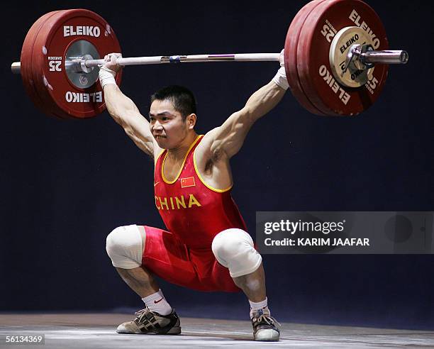 Zhang Ping of China lifts during the men's 62kg category in the World Weightlifting Championships in Doha, Qatar 10 November 2005. Ping won first...
