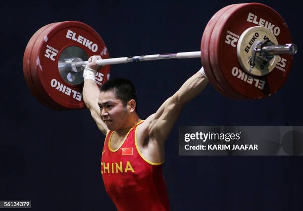Zhang Ping of China lifts during the men's 62kg category in the World Weightlifting Championships in Doha, Qatar 10 November 2005. Ping won first...