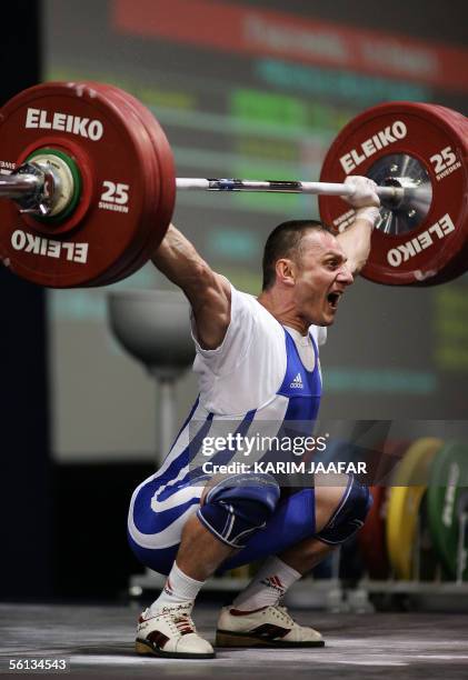Adrian Jigau of Romania lifts during the men's 62kg category in the World Weightlifting Championships in Doha, Qatar 10 November 2005. The Centennial...