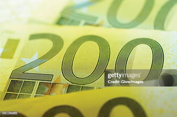 close-up of two hundred euro banknotes - two hundred euro banknote stock pictures, royalty-free photos & images