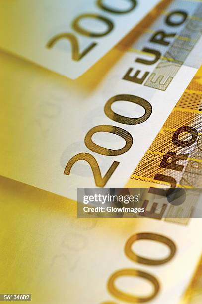 close-up of two hundred euro banknotes - two hundred euro banknote stock pictures, royalty-free photos & images