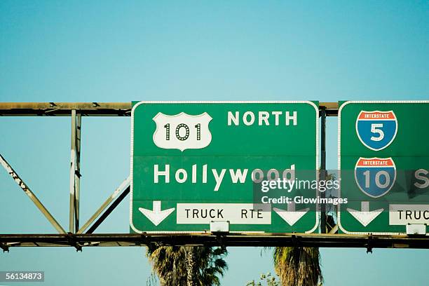 low angle view of highway signs to hollywood, los angeles, california, usa - hollywood schild stock-fotos und bilder