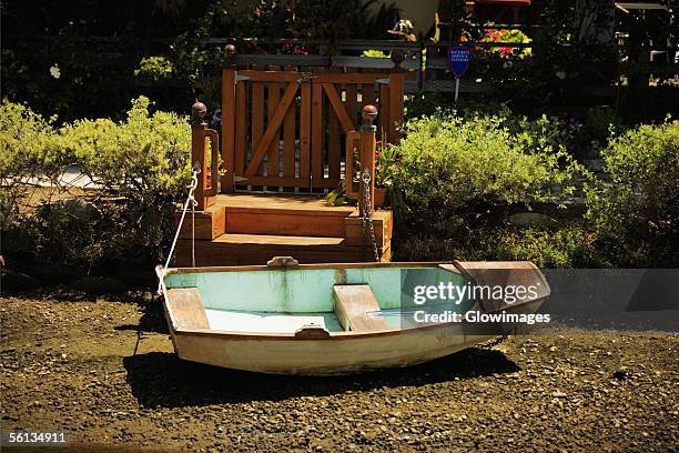 side profile of a rowboat on a shore - transpor stock pictures, royalty-free photos & images