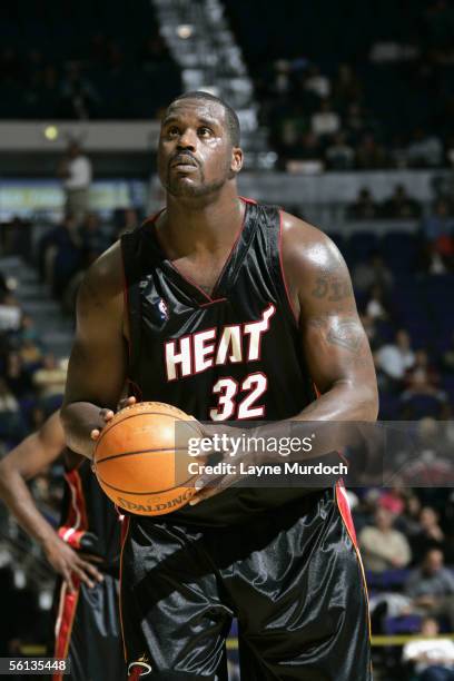 Shaquille O'Neal of the Miami Heat shoots a free throw against the New Orleans/Oklahoma City Hornets during a preseason game on October 25, 2005 at...