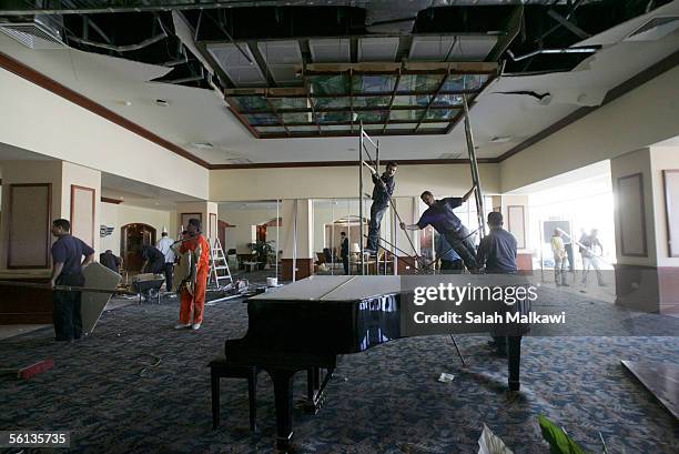 Jordanian policemen stand inside the Radisson SAS hotel, where a wedding party was being held when a bomb exploded November 10, 2005 in Amman,...