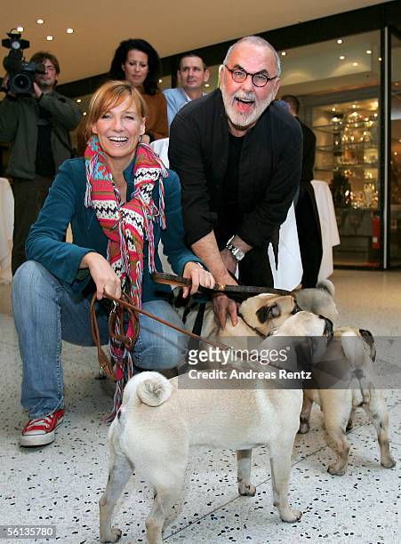 Hair stylist Udo Walz and Singer and television hostess Kim Fischer smile at the pre-opening of the new "Lifestyle Store for Dogs", a luxury...