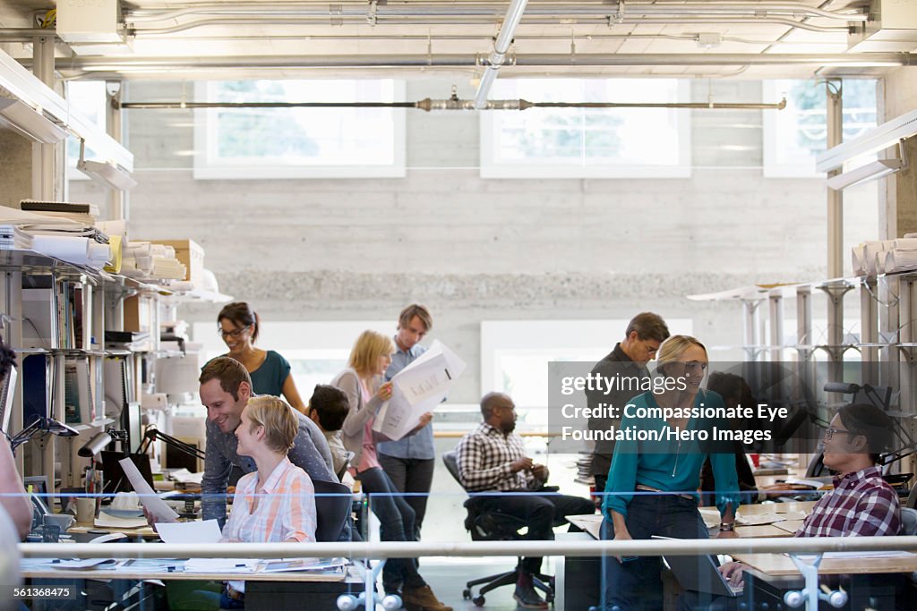 Business people working in busy office
