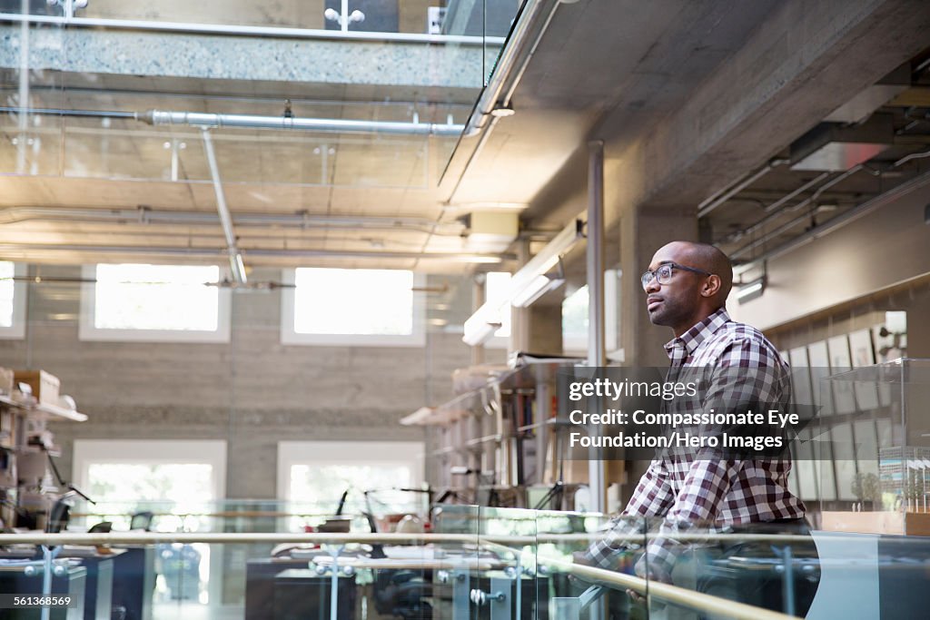 Portrait of businessman on office balcony