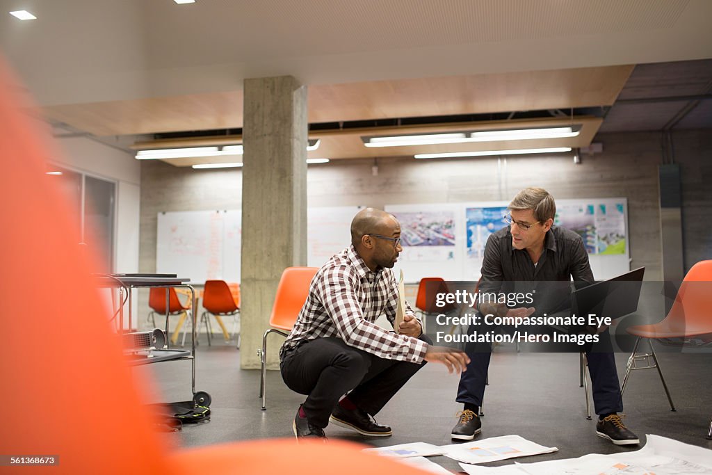 Businessmen having meeting in office