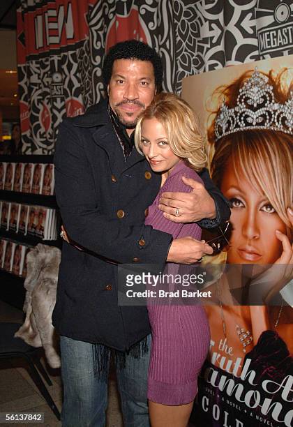 Lionel Richie and Nicole Richie share a moment at the "The Truth About Diamonds" book signing at the Virigin Mega Store in Times Square on November...