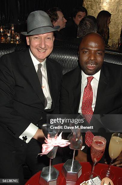 Stephen Jones and Duro Olowu with their awards are seen at the British Fashion Awards after party at the Aviva Nightclub in Kensington on November...