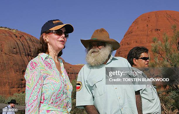 Queen Silvia of Sweden chats with Anangu-Pitjantjatjara Aboriginal elder Reggie Uluru and ranger Leroy Lester near Walpa Gorge in Uluru-Kata Tjuta...