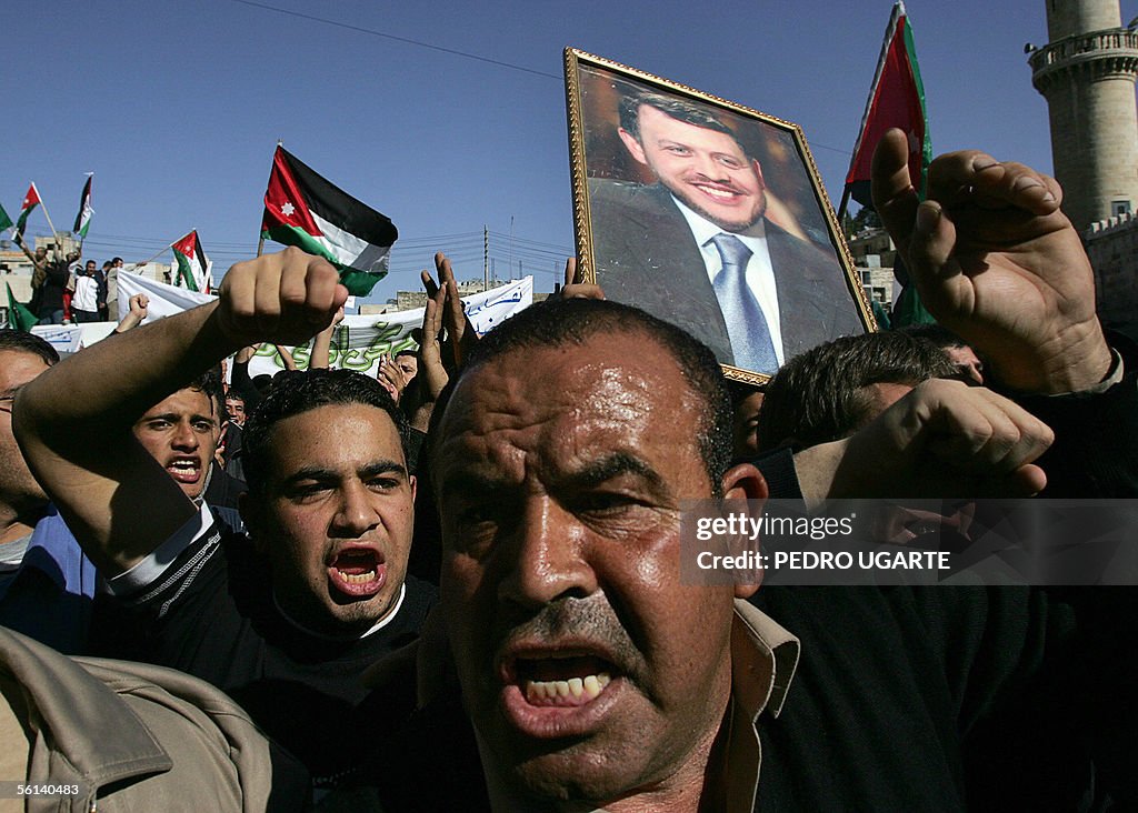 Jordanians shout as they take part in a