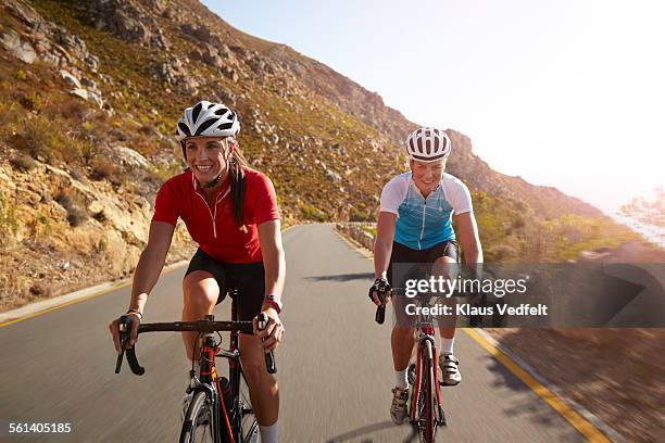 female pro cyclists laughing while training - women cycling stock pictures, royalty-free photos & images