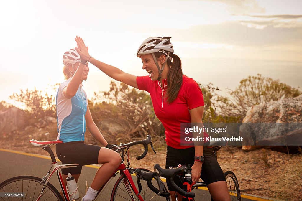 Bikeriders & training partners doing high-five