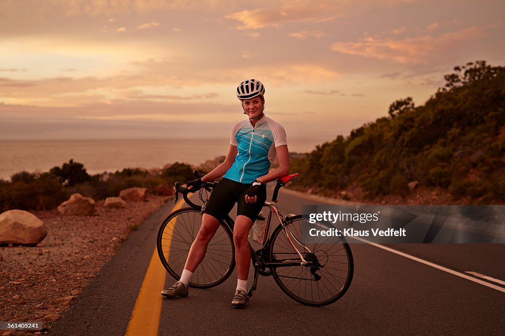Pro Bike Rider Pro Bike Rider Leaning Against Bike On The Road Stock-Foto - Getty Images