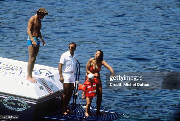 Christina Onassis, daughter of Greek shipping magnet Aristotle Onassis, Thierry Roussel and their daughter Athina, are seen during a holiday at Saint...