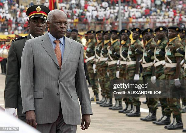 Angolan President Jose Eduardo dos Santos reviews the troops on the national day 11 November 2005 in Luanda to mark the 30th anniversary of...