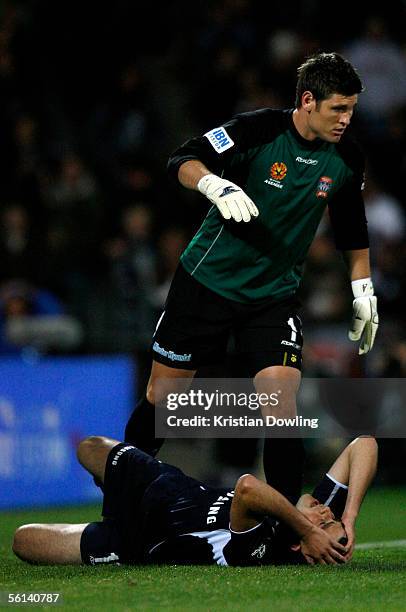 Liam Reddy for the Jets steps over Ricky Diaco for the Victory who looks dejected after narrowly missing a goal during the Round 12 A-League match...