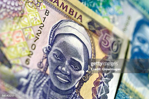 extreme close-up of gambian bank note - gambia stock pictures, royalty-free photos & images