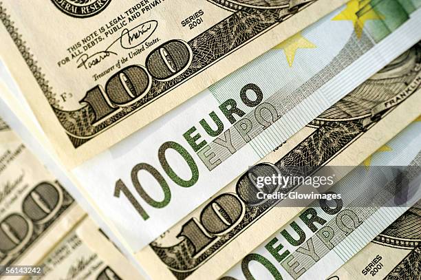 "euro 100 bank notes and united states one hundred dollar bills, close-up" - euro dollar stockfoto's en -beelden