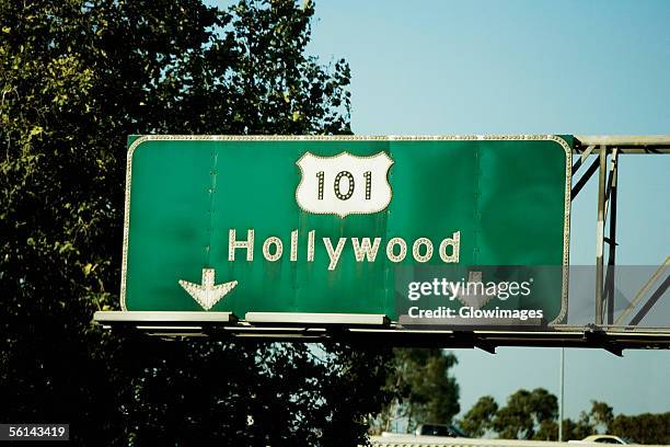 "low angle view of highway signs to hollywood, los angeles, california, usa" - hollywood sign fotografías e imágenes de stock