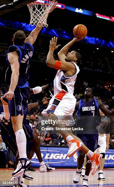 Sean May of the Charlotte Bobcats shoots the ball during their game against the Dallas Mavericks on November 11, 2005 at the Charlotte Bobcats Arena...