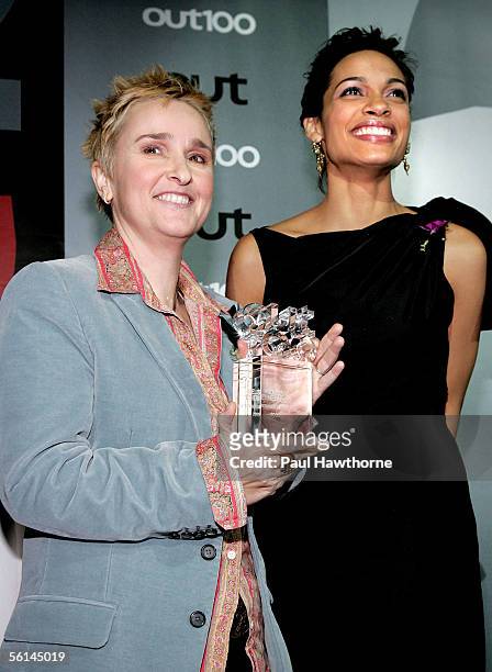 Singer Melissa Etheridge poses with host/actress Rosario Dawson after accepting the "Entertainer of the Year" award during Out Magazines 11th Annual...