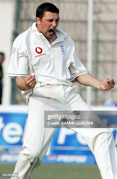 England cricketer Steve Harmison celebrates after taking a wicket off a Pakistani batsman during the opening day of the first Test match in Multan...