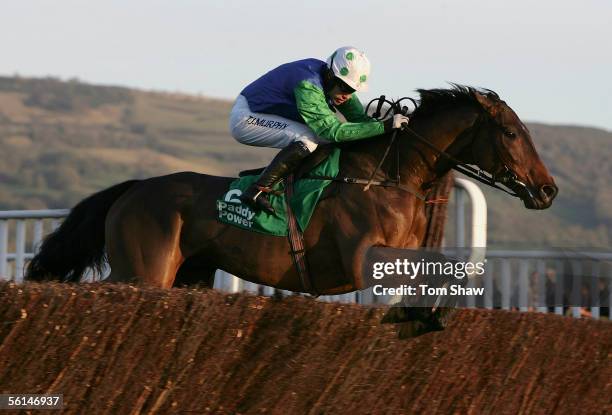 Our Vic ridden by Timmy Murphy jumps the final fence to win the Paddy Power Gold Cup during the Cheltenham Race meeting at Cheltenham Racecourse on...