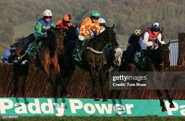 Our Vic ridden by Timmy Murphy jumps the fence on his way to winning the Paddy Power Gold Cup during the Cheltenham Race meeting at Cheltenham...