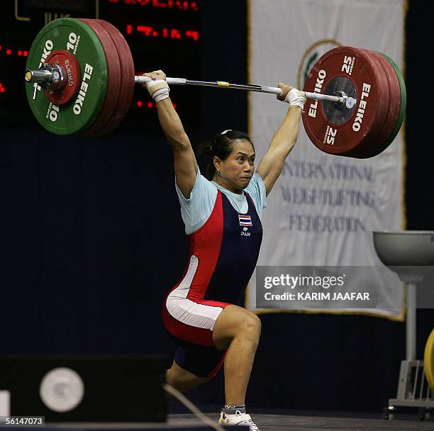 Pawina Thongsuk of Thailand lifts during the Women's 63kg category in the World Weightlifting Championships in Doha, 12 November 2005. AFP...