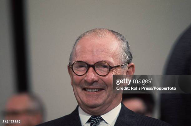 British Conservative Party politician and Member of Parliament for Wirrell, Selwyn Lloyd observes proceedings from the platform at the Tory Party...