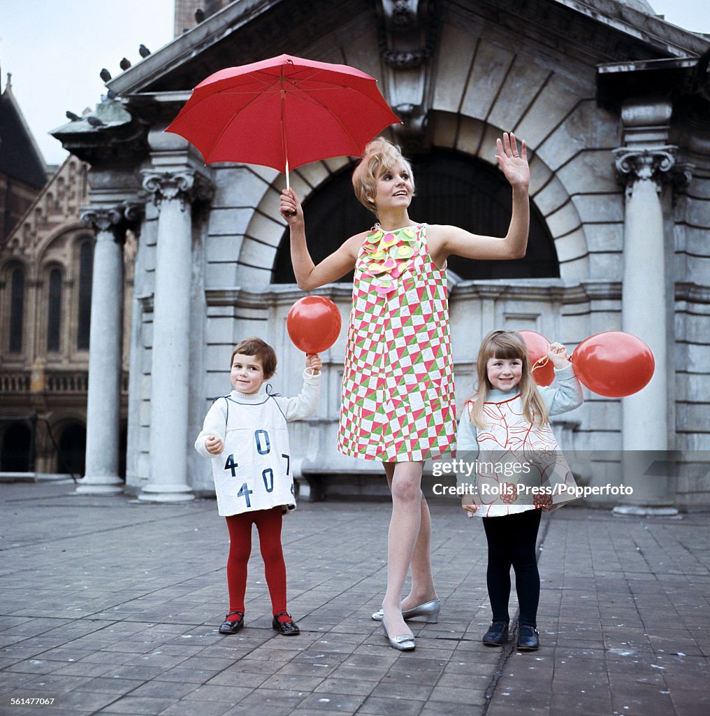 Sixties Fashion - A young female model wears a paper dress with a ...