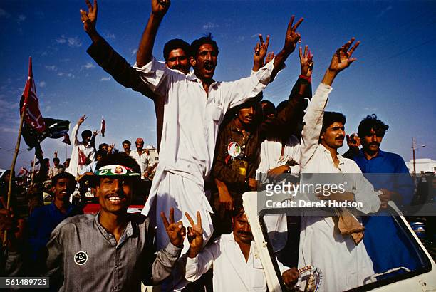 Supporters of former Prime Minister of Pakistan, Benazir Bhutto, gather in Lyari, a neighbourhood of Karachi, Pakistan, to hear her speak, 11th...