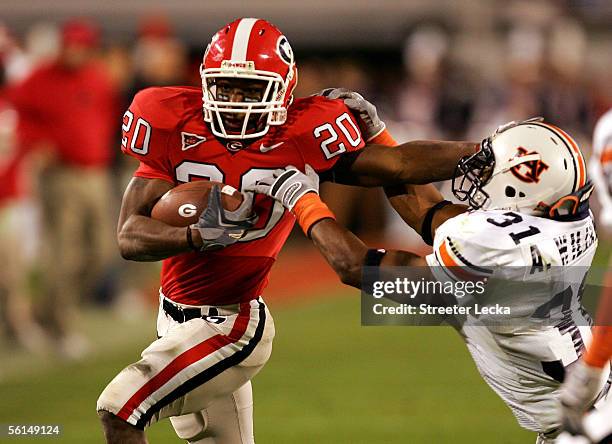 Antarrious Williams of the Auburn Tigers tries to tackle Thomas Brown of the Georgia Bulldogs during their game November 12, 2005 at Sanford Stadium...