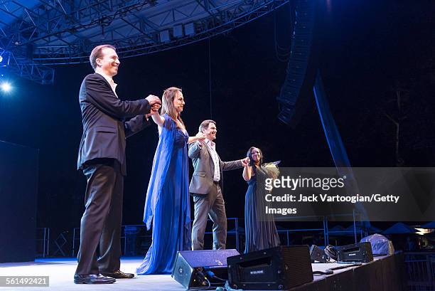 From left, American pianist Dan Saunders, mezzo-soprano Isabel Leonard, baritone Nathan Gunn, and soprano Janai Brugger take bows at the conclusion...