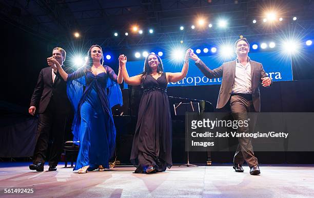 From left, American pianist Dan Saunders, mezzo-soprano Isabel Leonard, soprano Janai Brugger, and baritone Nathan Gunn take bows at the conclusion...