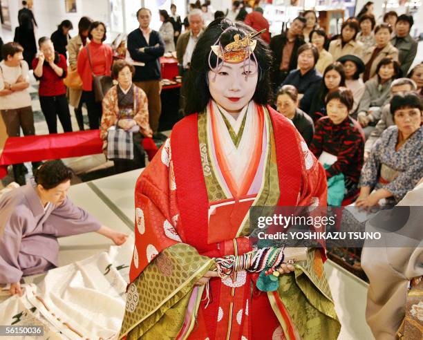 Model wears an ancient Japanese formal court ensemble called a junihitoe during a kimono show at Tokyo's Mitsukoshi department store 13 November 2005...