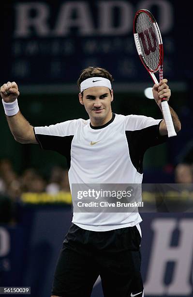 Roger Federer of Switzerland celebrates his three set victory against David Nalbandian of Argentina in his first match of the round robin during the...