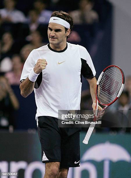 Roger Federer of Switzerland celebrates a point against David Nalbandian of Argentina in his first match of the round robin at the Tennis Masters...