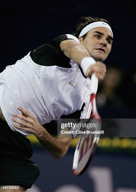 Roger Federer of Switzerland serves against David Nalbandian of Argentina in his first match of the round robin at the Tennis Masters Cup, at the Qi...