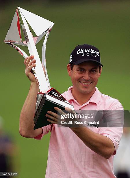 David Howell of England poses with the winners trophy after the final round the HSBC Champions Tournament at the Sheshan International Golf Club on...