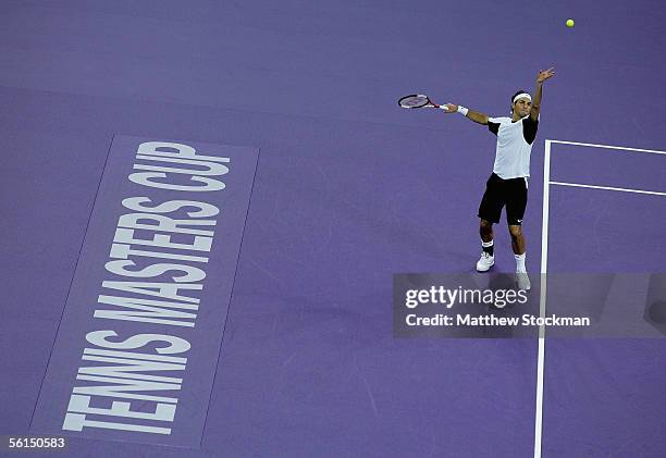 Roger Federer of Switzerland serves to David Nalbandian of Argentina during the first round of the Tennis Masters Cup at Qi Zhong Stadium November...