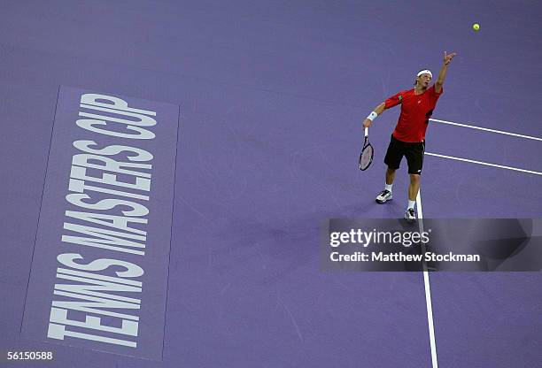 David Nalbandian of Argentina serves to Roger Federer of Switzerland during the first round of the Tennis Masters Cup at Qi Zhong Stadium November...