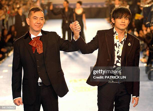 Hong Kong movie star Anthony Wong joins hands with Jay Chou on the stars boulevard at Keelung Culture Center 13 November 2005 for the 42nd Golden...